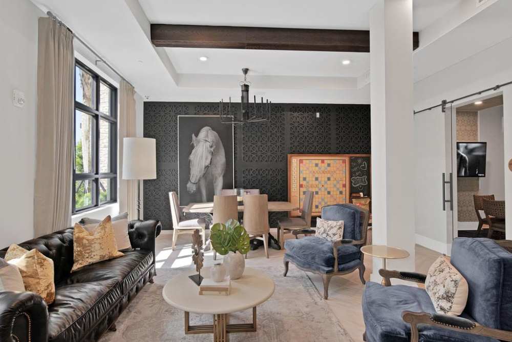 Clubhouse with multiple sofas and chairs at Palmera in Doral, Florida