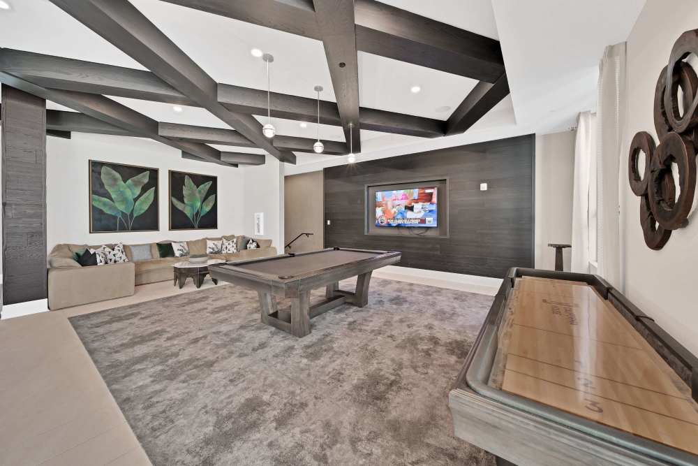 Community Lounge Overlooking Pool With Entertaining Bar And Billiards at Palmera in Doral, Florida