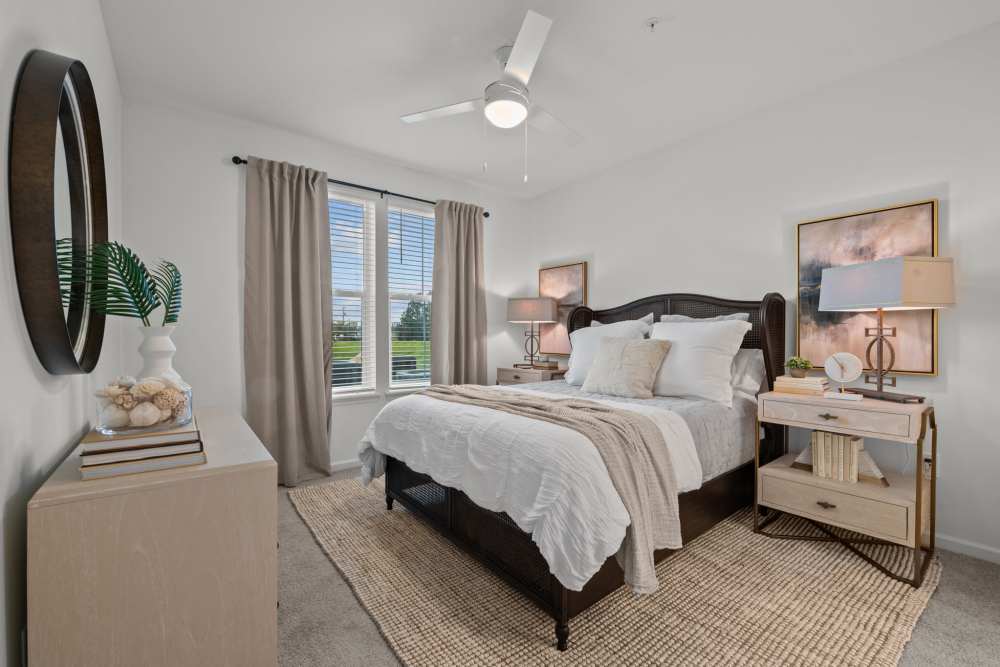 Bedroom with plush carpeting at Palmera in Doral, Florida