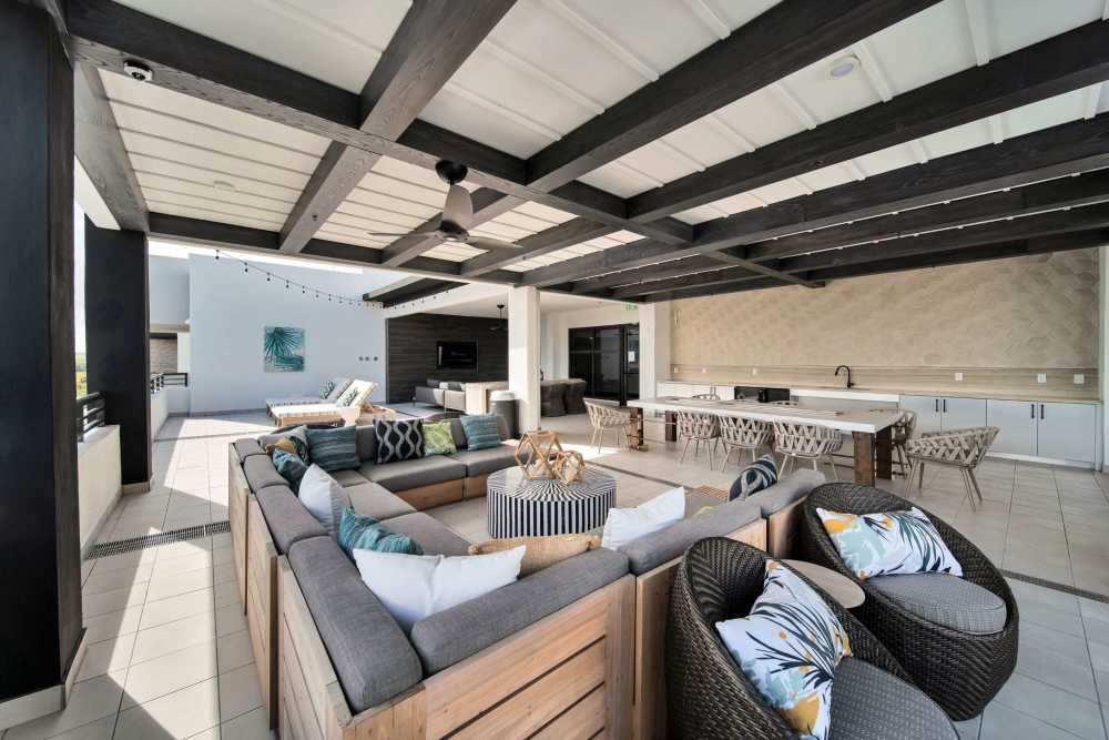 Covered patio with cozy counches at Palmera in Doral, Florida