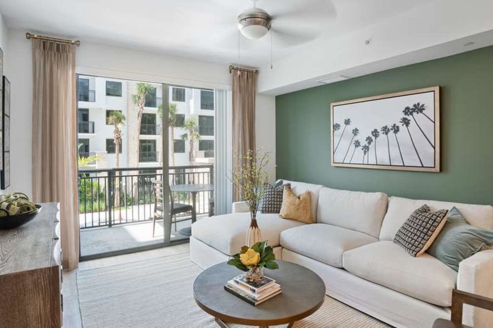 Living space with access to the balcony at Palmera in Doral, Florida